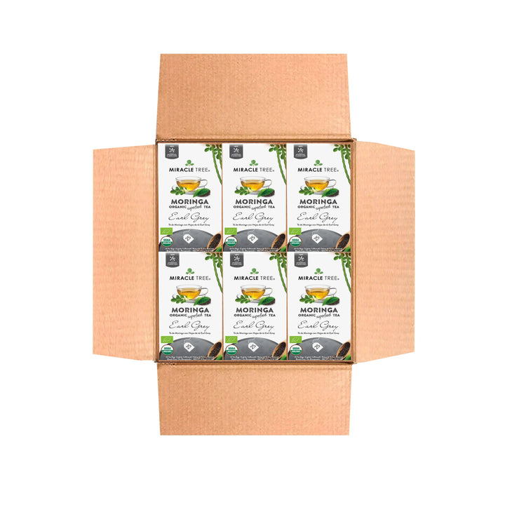 Bulk tea carton pack with organic moringa Earl Grey labels in open cardboard box