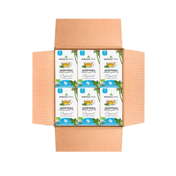 Kraft shipping box with Miracle Tree Moringa Original tea packets on top