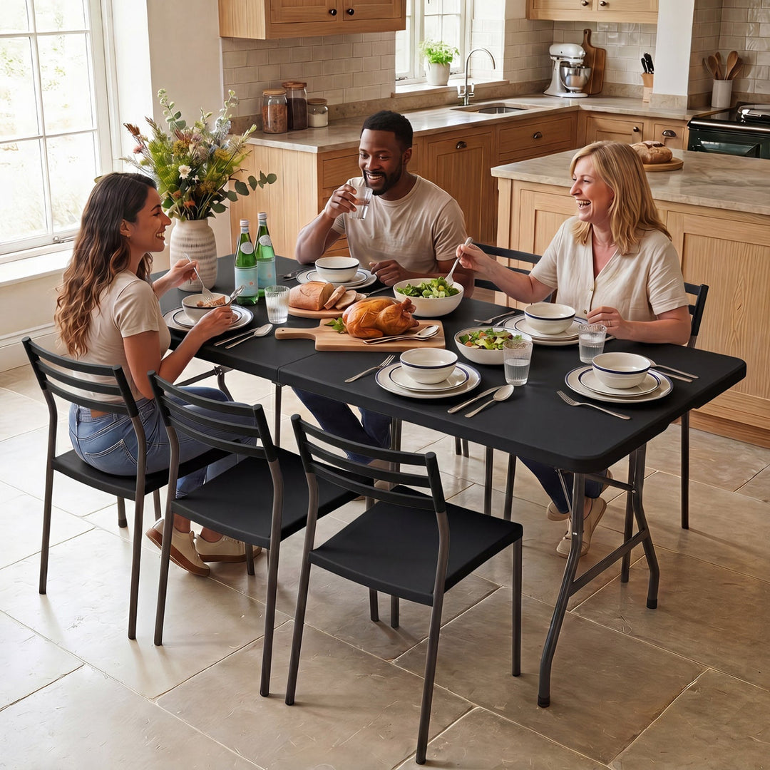 Matte black fold-in-half camping table with rattan-textured tabletop and supporting legs
