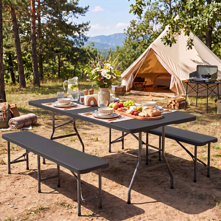 Fold-in-half camping dining table with matte black top and bench seating