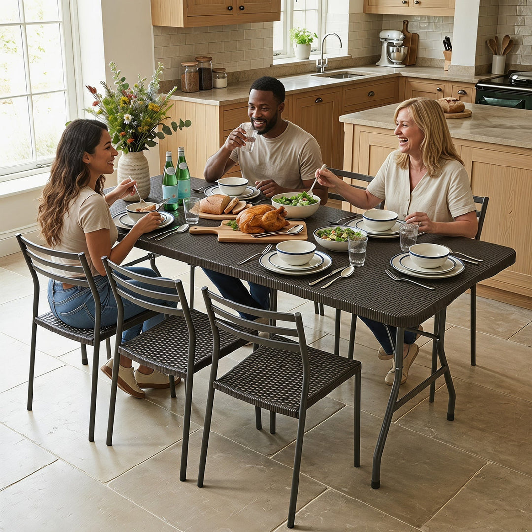 Folding camping table with rattan-texture top and metal legs, set for outdoor dining
