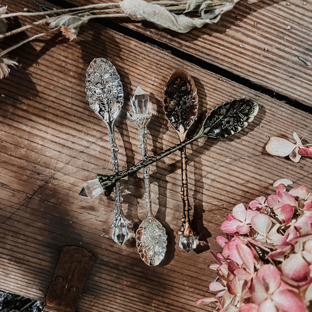Crystal stirring spoons with faceted bowls and ornate metal handles