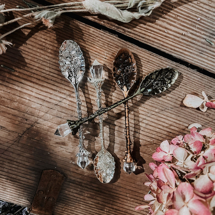 Crystal stirring spoons with faceted bowls and ornate metal handles