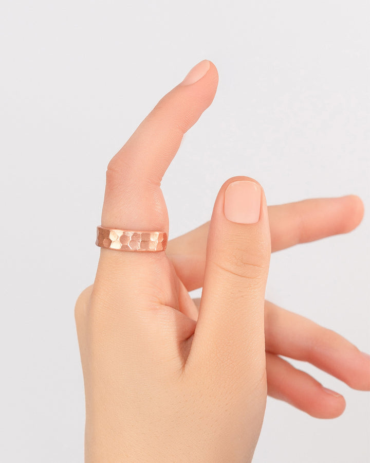 Hammered copper band ring, 6mm, worn on a finger