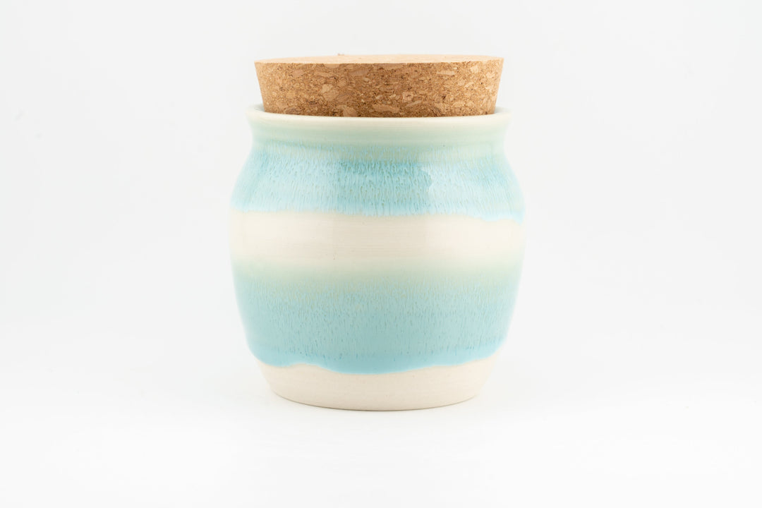 Corked 6 oz jar with light blue and cream glaze and cork lid