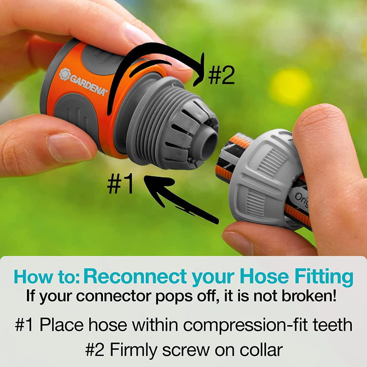 Hands reconnecting hose fitting on gray roll-up garden hose reel with blue ring