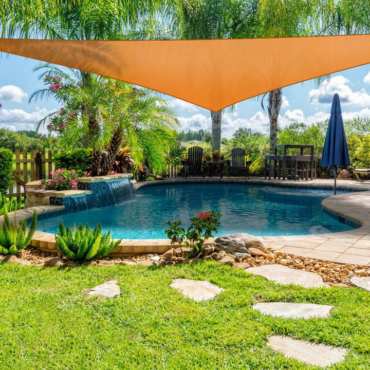 Orange triangular shade sail canopy installed for pool-side shade