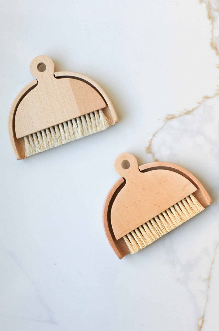 Wood table brush with loop handle and light wood body, tan bristles
