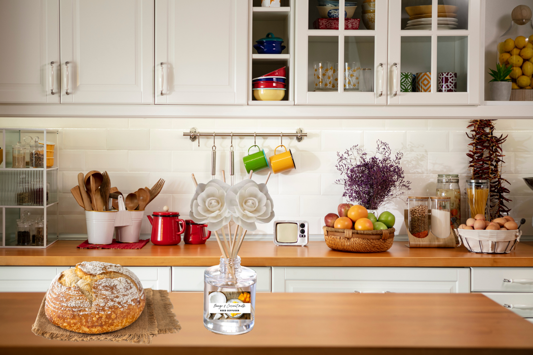 Reed diffuser bottle with rose topper on kitchen counter with colorful jars