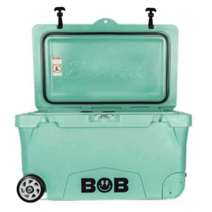 Palm green hard cooler with open lid, handle detail, and black BOB logo.