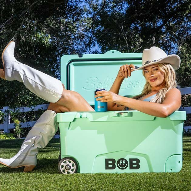Palm green hard cooler with BOB logo, hinged lid, and wheels.