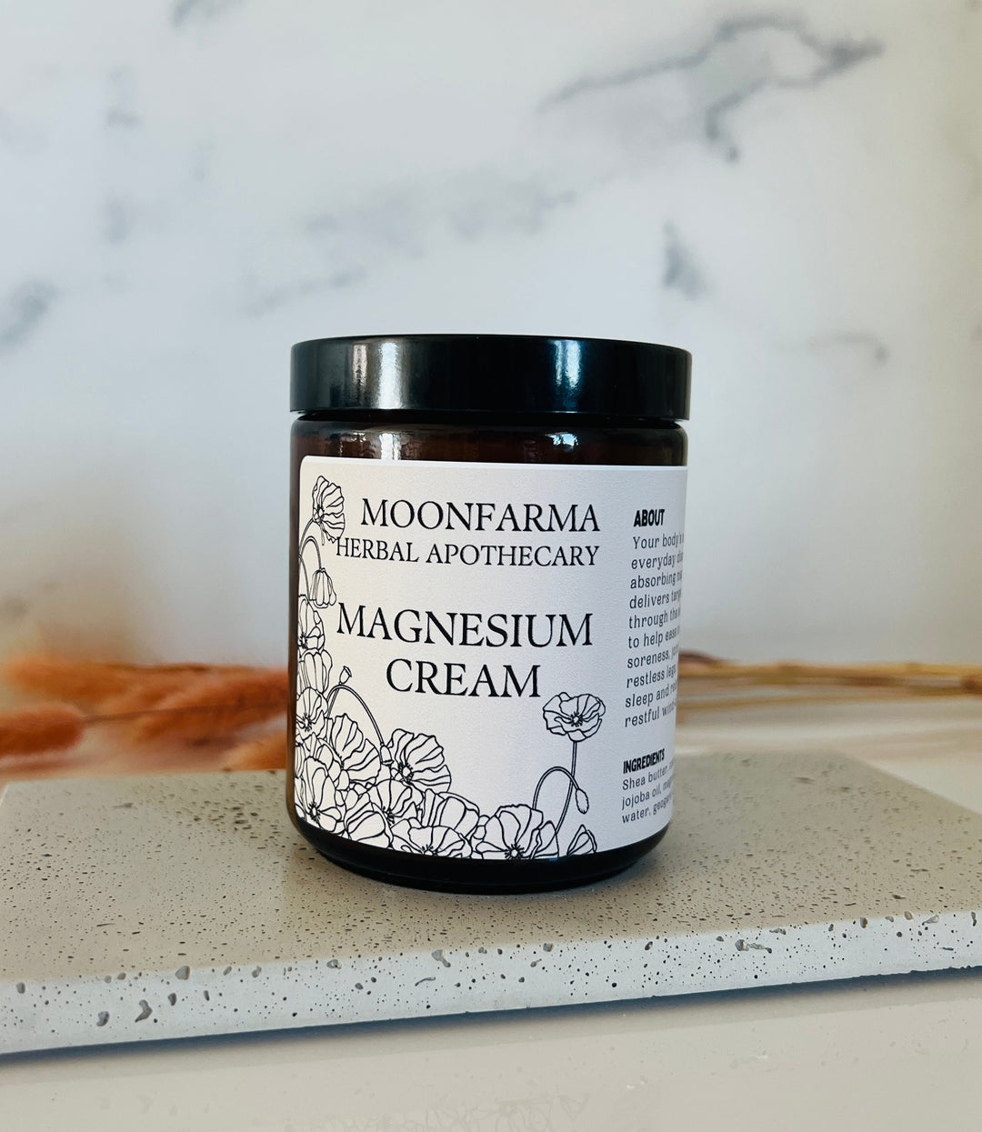Magnesium cream jar with black lid and Moonfarma label