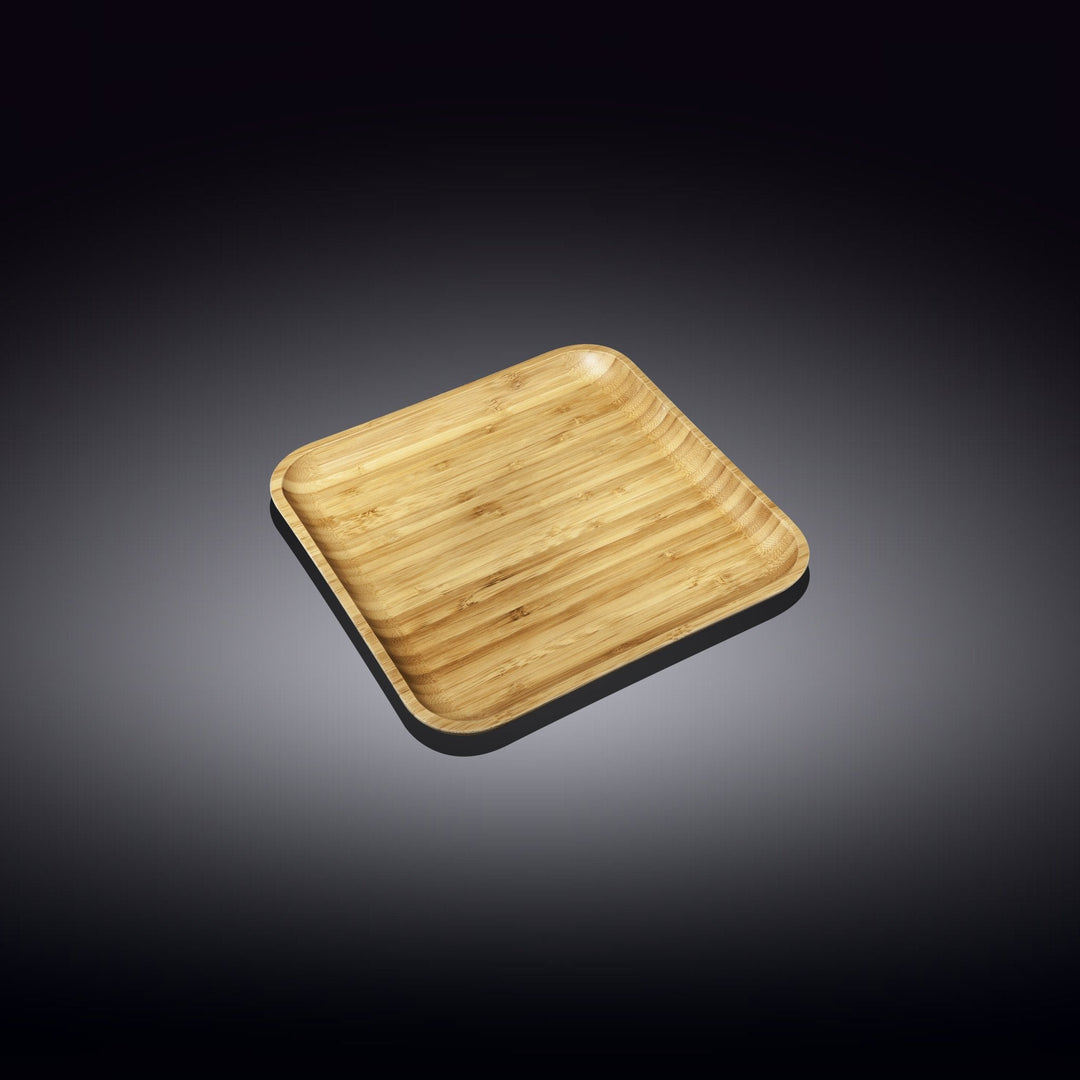 Square bamboo plate shown from above, warm light wood grain