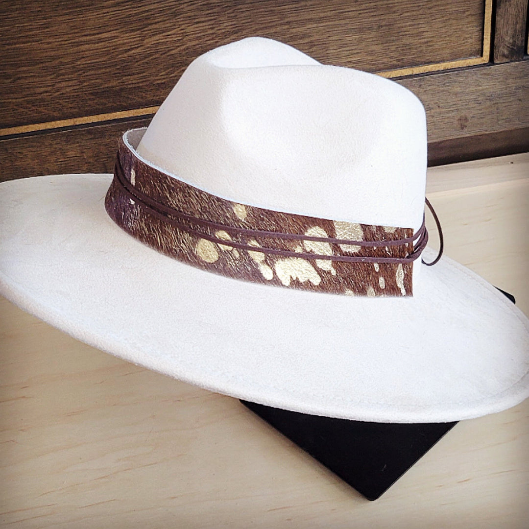 White wide-brim felt hat with brown band featuring metallic gold and white speckles