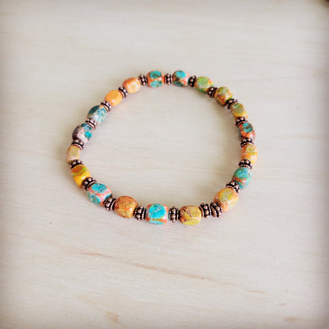 Sunrise-style stretch beaded bracelet with multicolor glass and copper-tone beads
