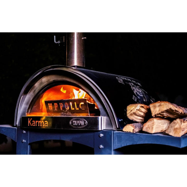 Flame heat deflector panel on outdoor pizza oven, engraved lettering visible