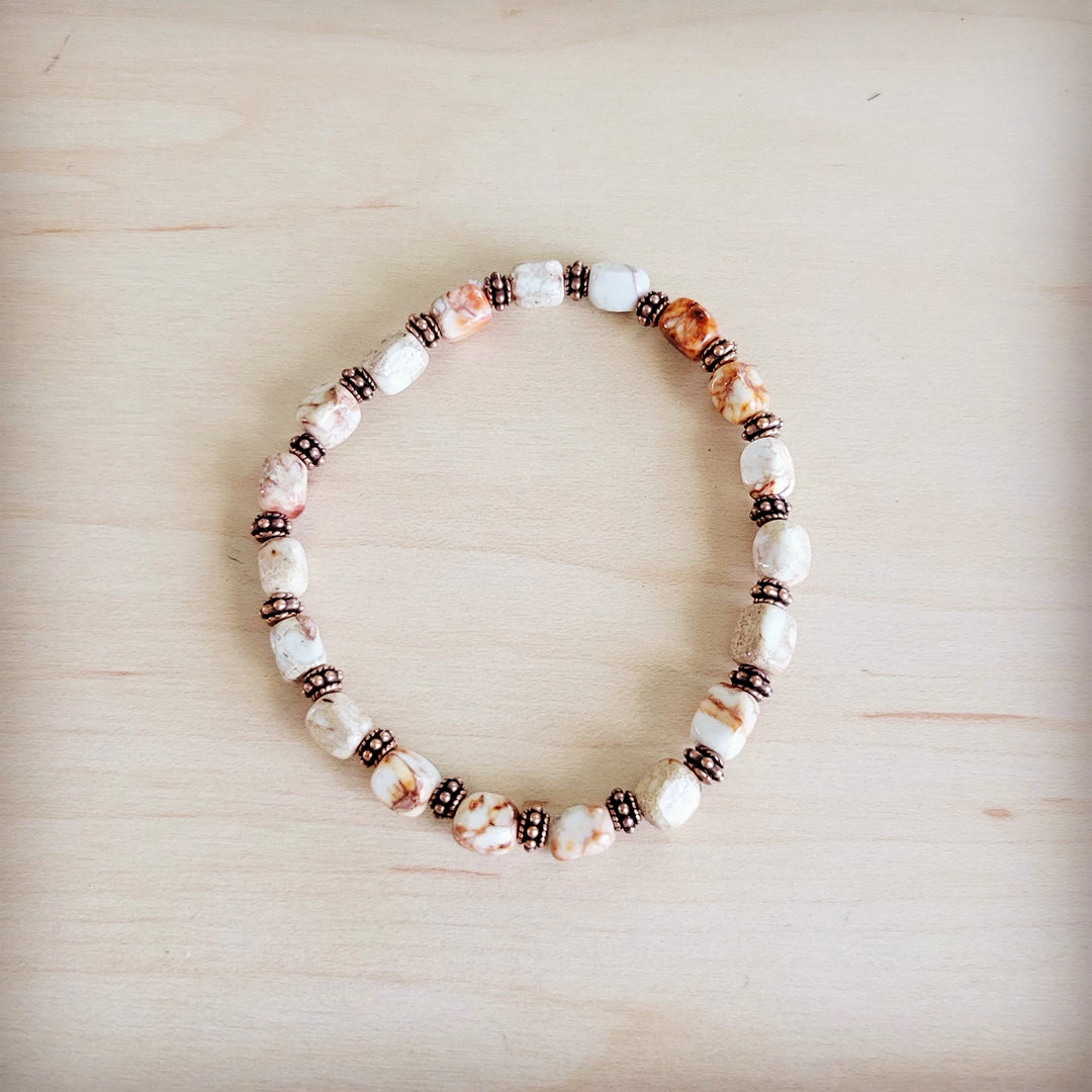 Sandstone and copper stretch beaded bracelet, alternating white stones and dark bead spacers