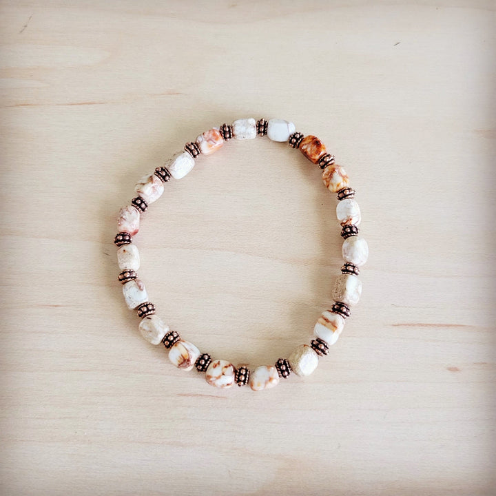 Sandstone and copper stretch beaded bracelet, alternating white stones and dark bead spacers