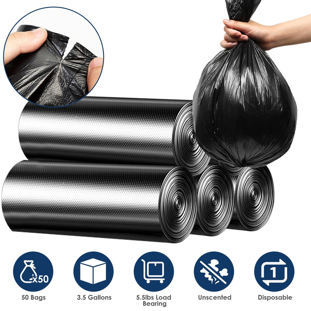 Black garbage bag rolls, hand holding tied liner, textured plastic close-up