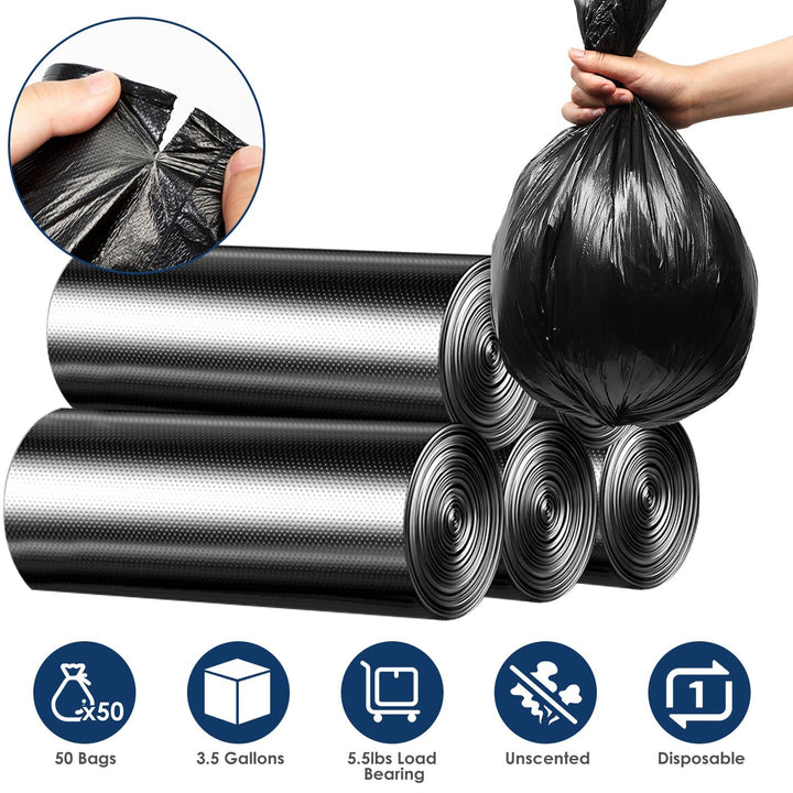 Black garbage bag rolls, hand holding tied liner, textured plastic close-up