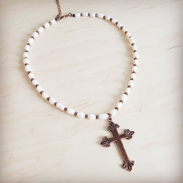 Freshwater pearl bead necklace with copper-toned cross pendant detail