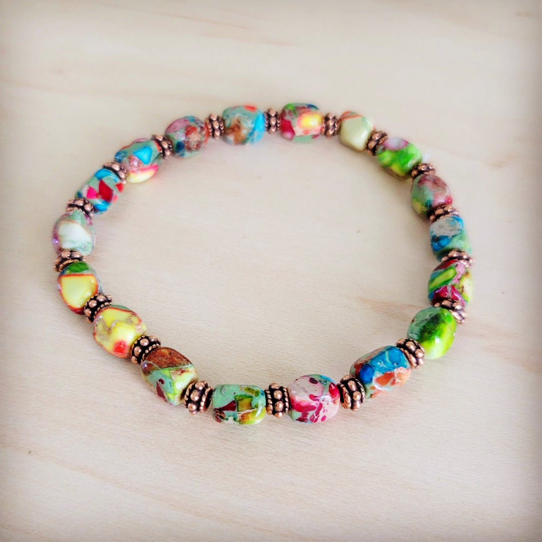 Rainbow multi-color stretch beaded bracelet with copper-toned accents and glossy beads