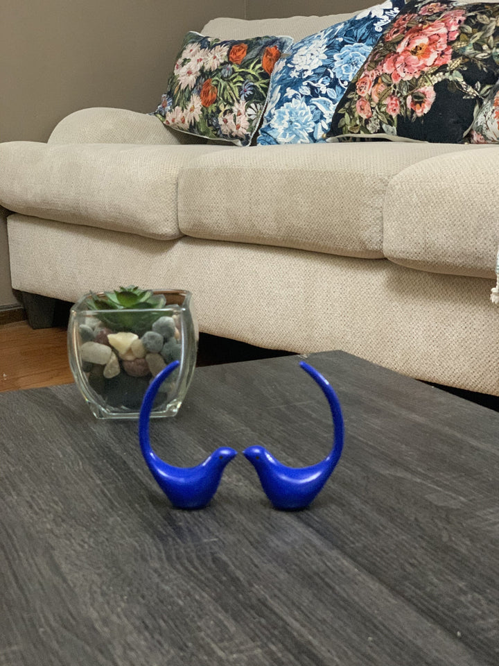 Blue bird figurine pair with glass jar filled with decorative stones