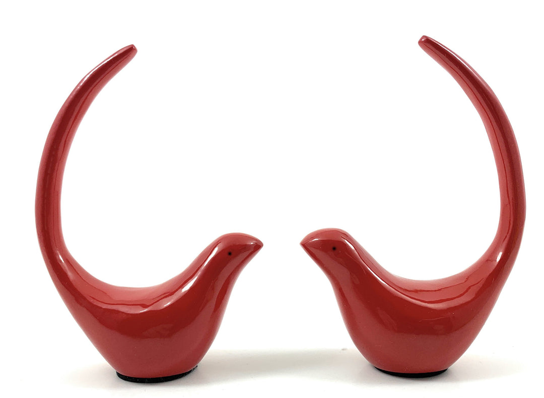 Red bird figurine pair, close front view with arched necks, glossy finish