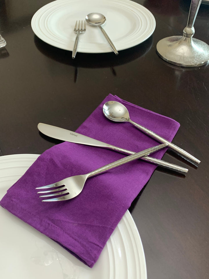 Vibhsa stainless steel cutlery set with knife, fork, and spoon on plates
