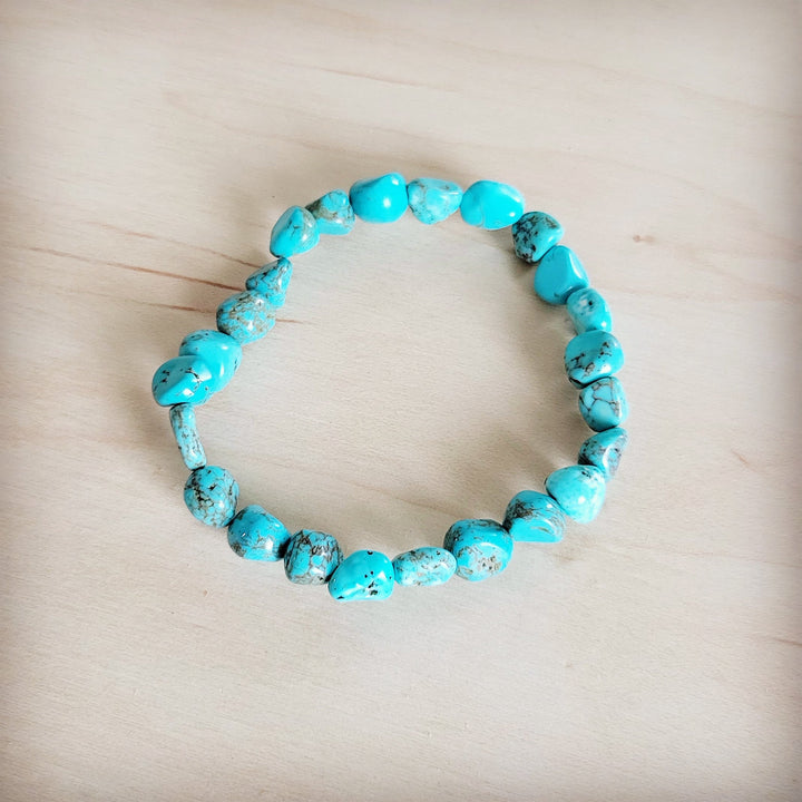 Turquoise beaded stretch bracelet with small round beads, bright blue-green