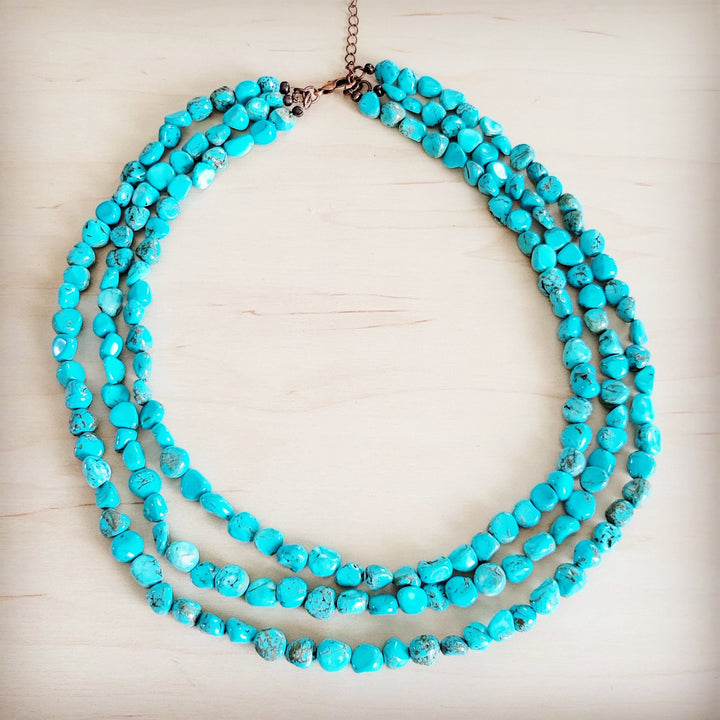 Triple-strand turquoise bead collar necklace with copper-toned metal clasp at top