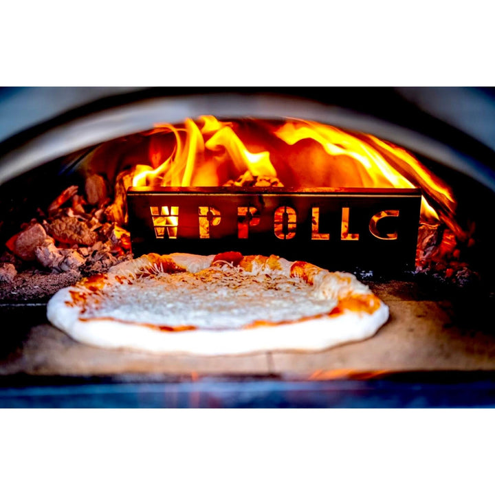 Wood-fired oven interior with pizza on stone and flames burning inside