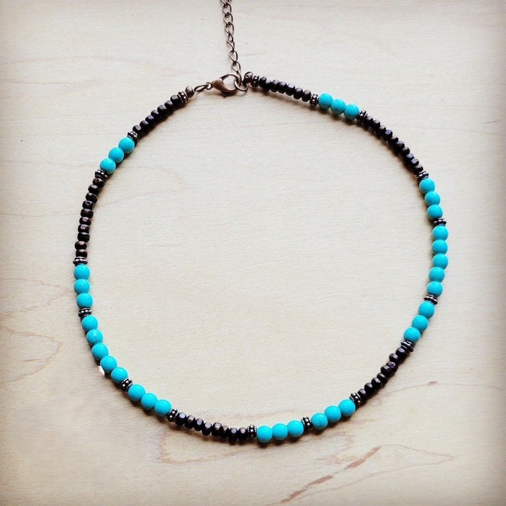 Turquoise blue bead collar necklace with dark bead row and copper-tone clasp chain.