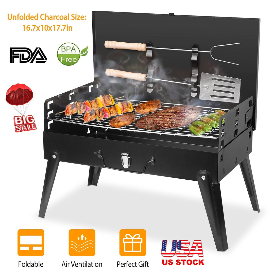 Black portable charcoal grill with foldable legs, cooking grate, and side shelf