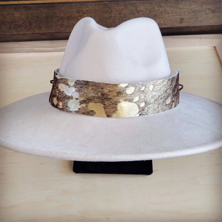 White wide-brim felt hat with brown hair-hide band with metallic gold highlights