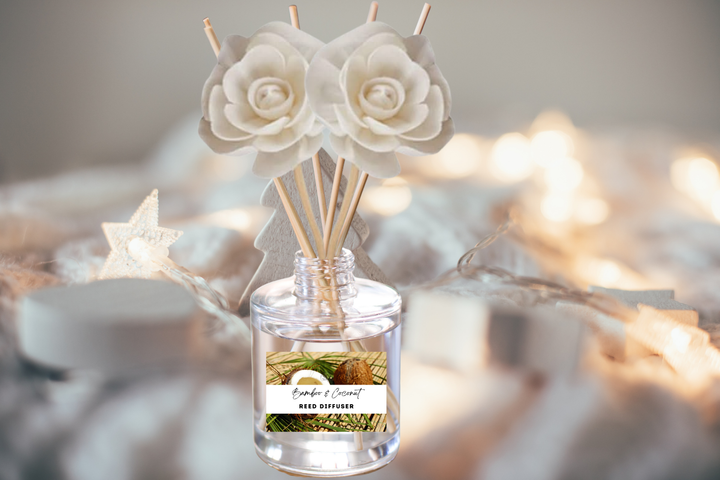 Reed diffuser bottle with wooden reeds, wrapped by soft starfish and beach-themed decor
