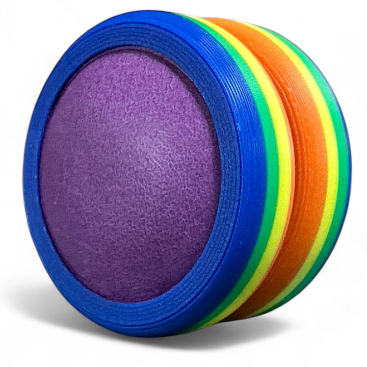Rainbow pride ring with blue and purple bands and purple inner oval.