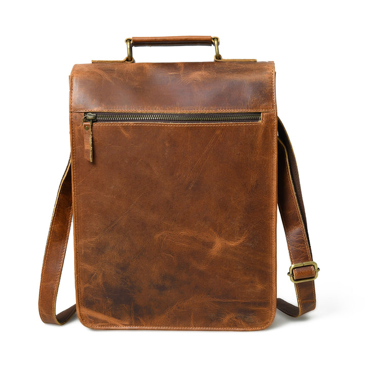 Brown leather crossbody bag front view with zip pocket and side strap