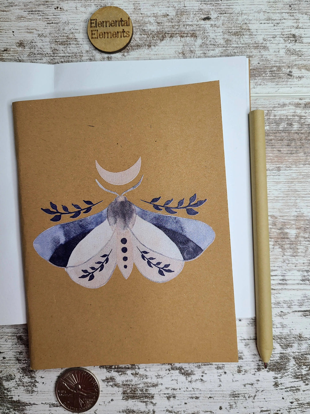 Brown journal front cover with watercolor moon moth design