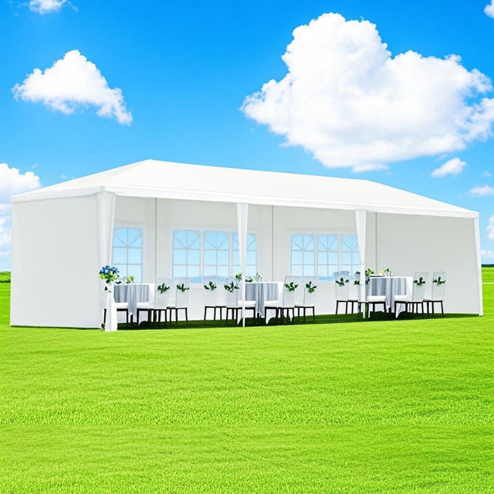 Outdoor canopy tent with multiple windowed side panels for event seating