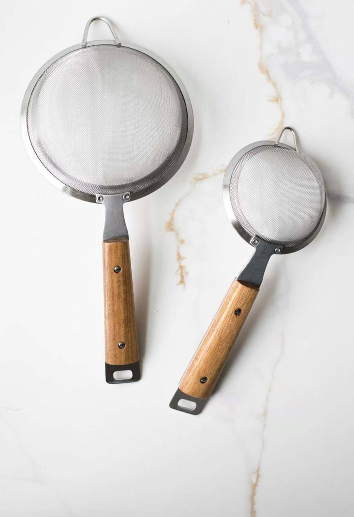 Pair of round mesh strainers: large and small with silver rims and wood handles