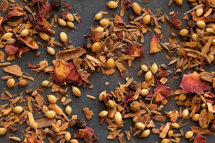 Ground advieh spice blend with herbs and seeds, loose and scattered
