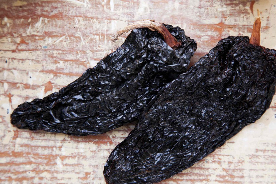 Dried ancho chili peppers, dark wrinkled whole pods