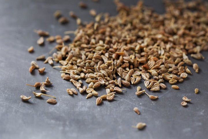 Anise seeds scattered in a loose pile
