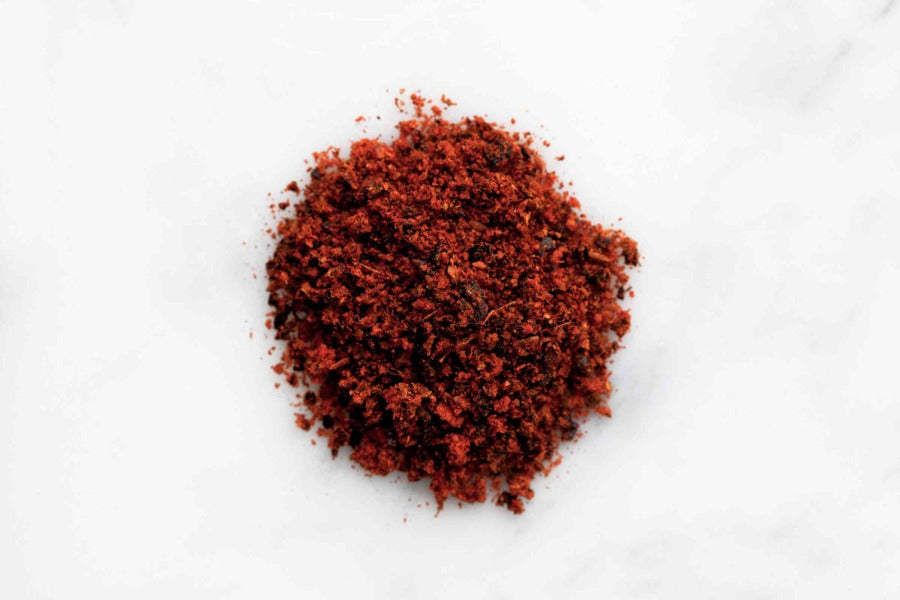 Pile of finely ground red-brown ancho chili powder