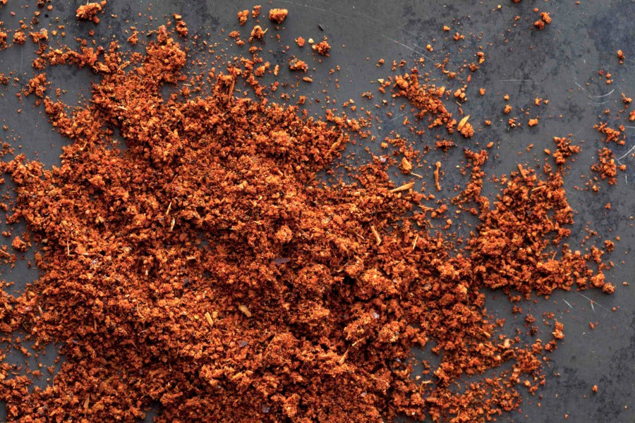 Spicy ground chorizo seasoning blend with orange-red flakes