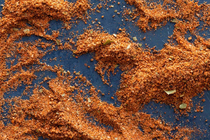 Elliott Bay seasoning granules, orange-brown spice blend with fine flakes