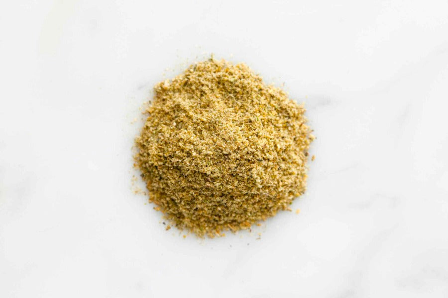 Pile of finely ground green-yellow spice blend