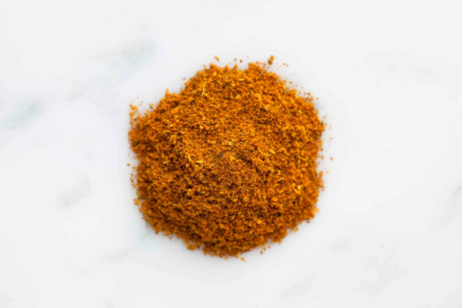 Mound of golden-orange curry spice powder