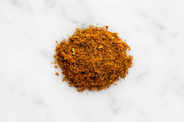 Kashmiri curry seasoning ground spice powder in a small mound